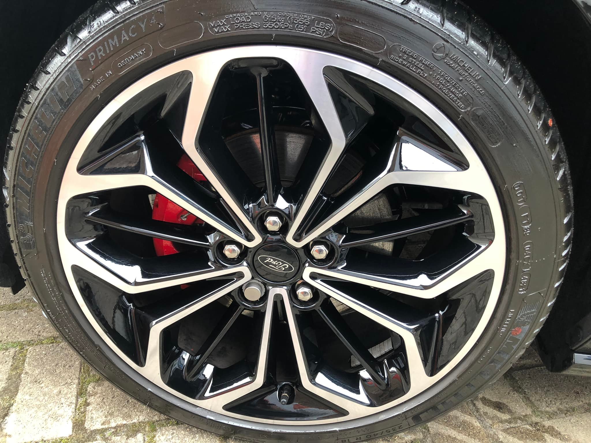 Close-up of a freshly cleaned alloy wheel